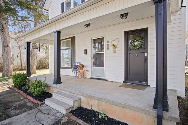 view of exterior entry with covered porch