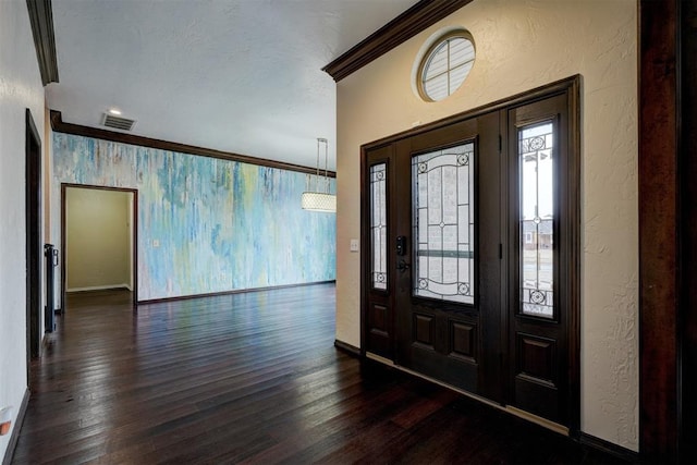 entryway featuring crown molding and dark hardwood / wood-style floors