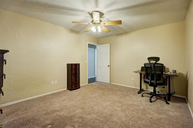 office space with carpet floors and ceiling fan