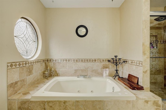 bathroom featuring a relaxing tiled tub