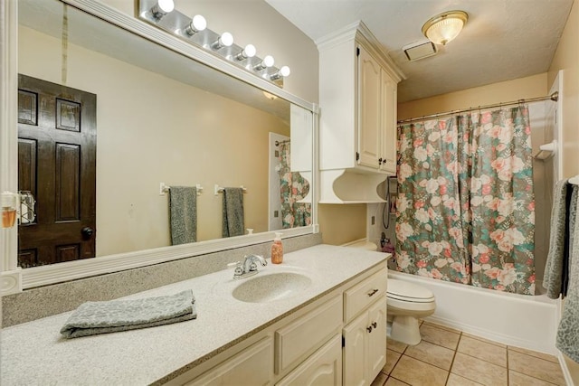 full bathroom with vanity, tile patterned floors, toilet, and shower / tub combo with curtain