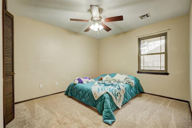 bedroom featuring ceiling fan and carpet flooring