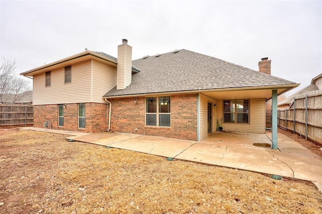 back of property with a patio