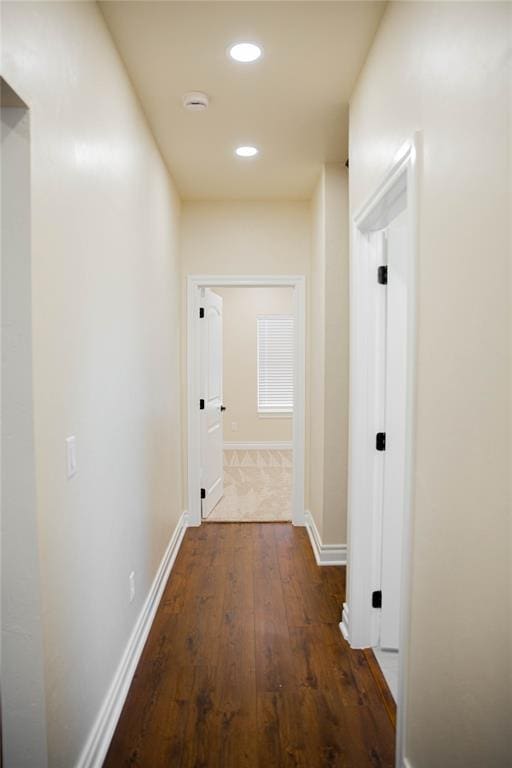 hall with dark hardwood / wood-style floors