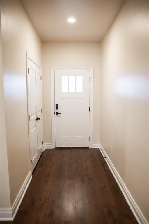 entryway with dark wood-type flooring