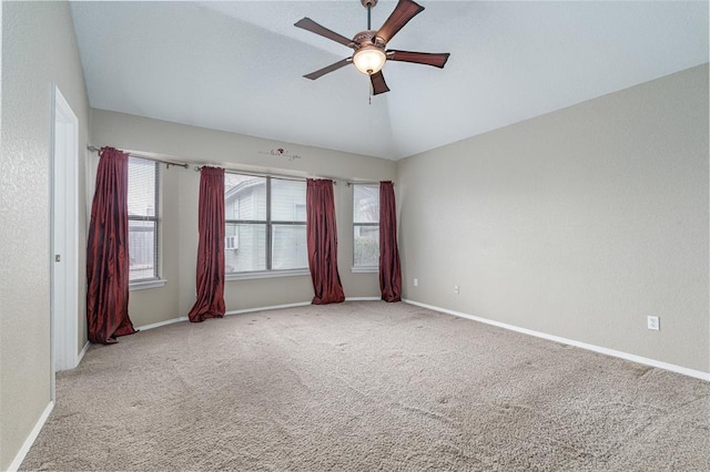 unfurnished room featuring lofted ceiling, carpet flooring, and ceiling fan