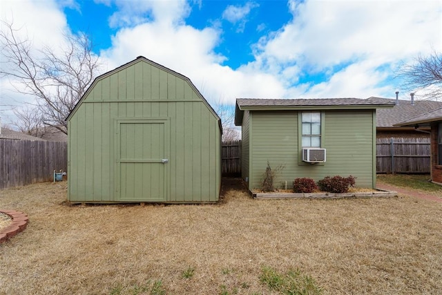 view of outbuilding with cooling unit and a yard