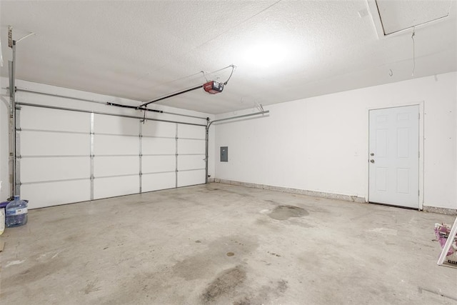 garage featuring a garage door opener and electric panel