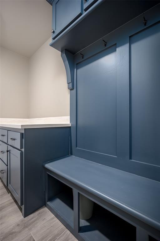 mudroom with light hardwood / wood-style floors