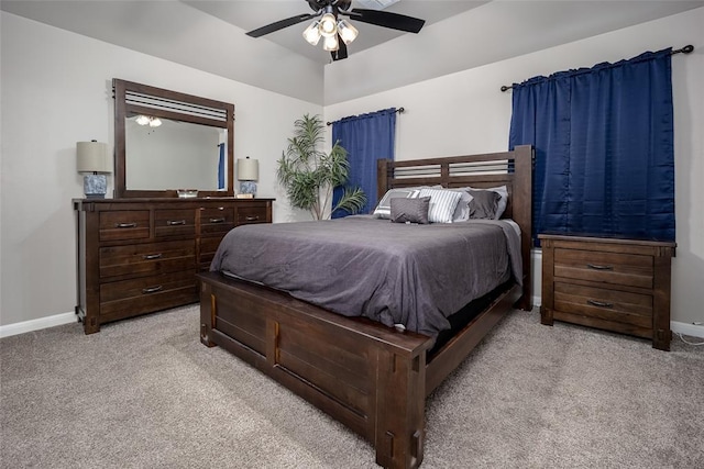 bedroom featuring light colored carpet and ceiling fan