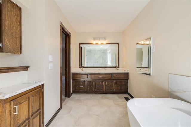 bathroom with vanity and a tub