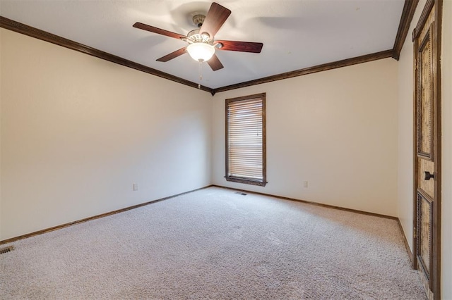 carpeted empty room with crown molding and ceiling fan