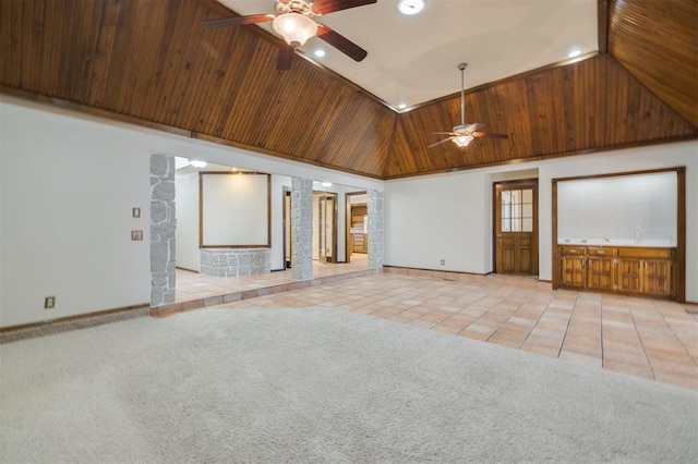 unfurnished living room featuring ceiling fan, light colored carpet, wood ceiling, and high vaulted ceiling