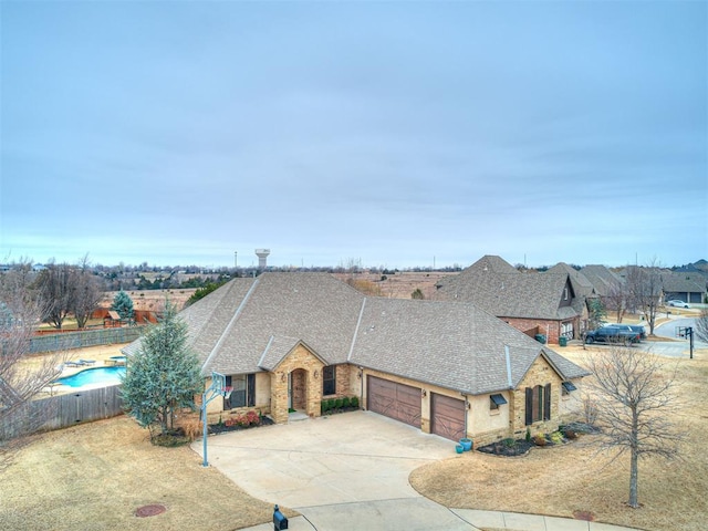 ranch-style home with a garage