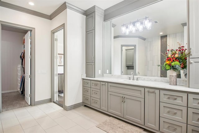 bathroom featuring crown molding, baseboards, recessed lighting, tile patterned floors, and vanity