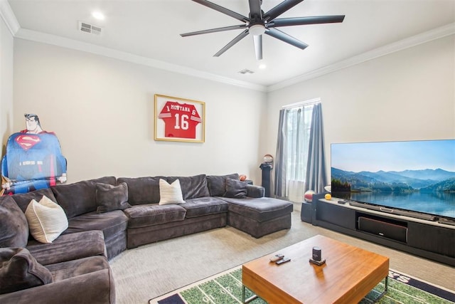 carpeted living area featuring visible vents, a ceiling fan, and crown molding