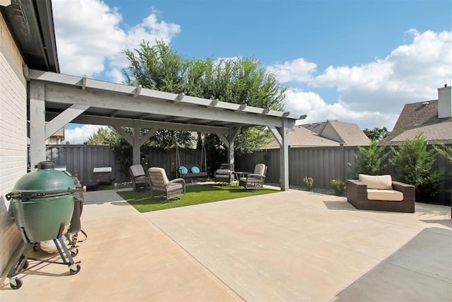 view of patio / terrace with an outdoor living space, a pergola, and a fenced backyard