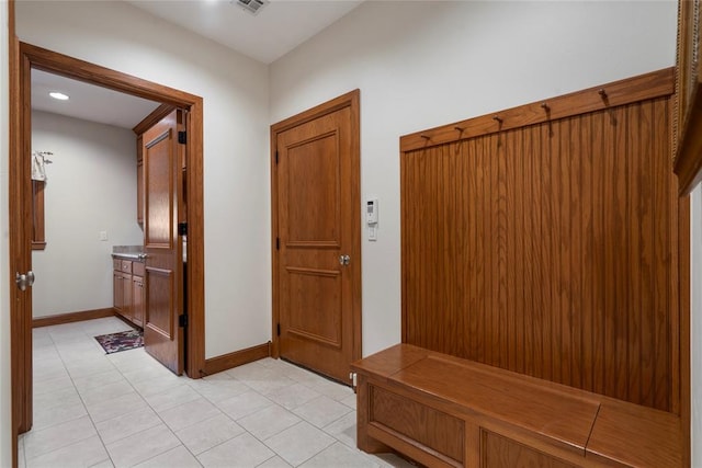 mudroom featuring light tile patterned floors