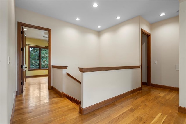 hall with light hardwood / wood-style flooring