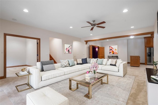 living room with light carpet and ceiling fan