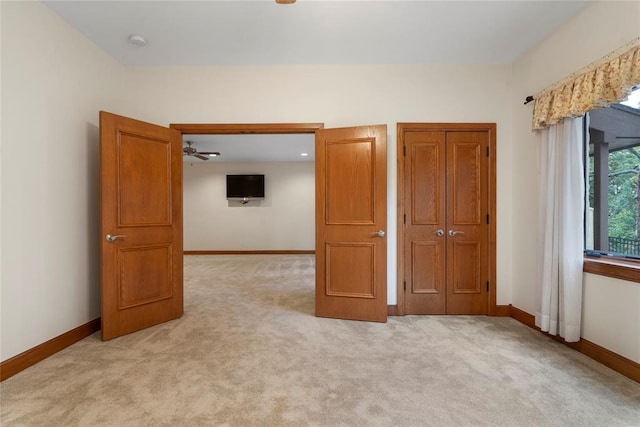 unfurnished bedroom with light carpet