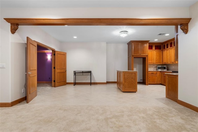 unfurnished living room with light colored carpet