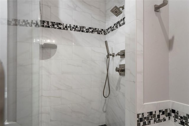 bathroom with tiled shower