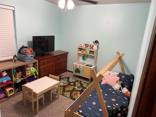 playroom featuring carpet flooring and ceiling fan