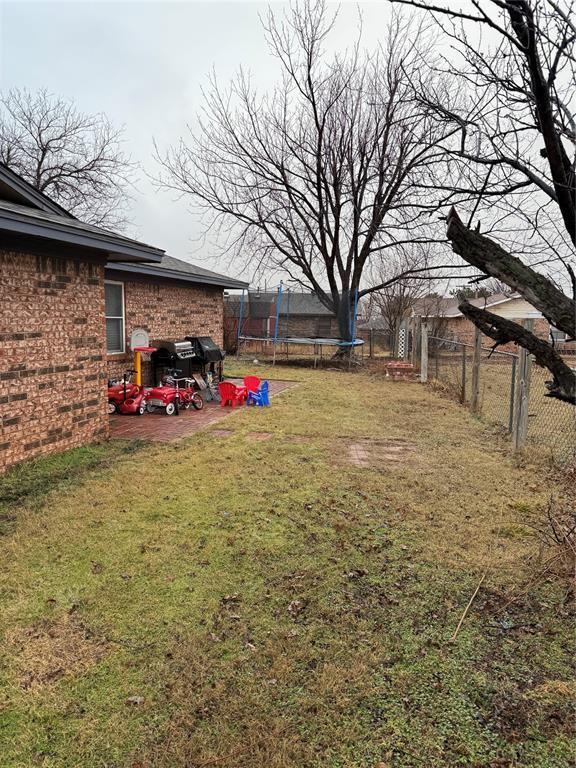 view of yard with a trampoline