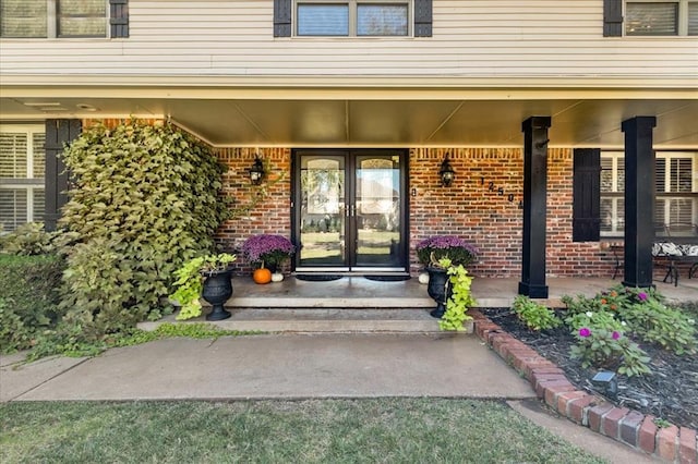 view of exterior entry featuring french doors