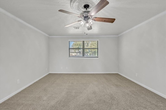 carpeted spare room featuring crown molding, a textured ceiling, and ceiling fan