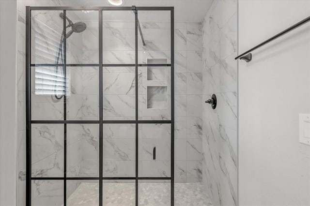 bathroom with tiled shower