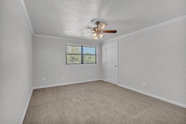 carpeted empty room featuring a textured ceiling, ornamental molding, and ceiling fan