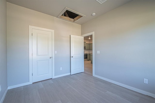 unfurnished bedroom featuring wood-type flooring