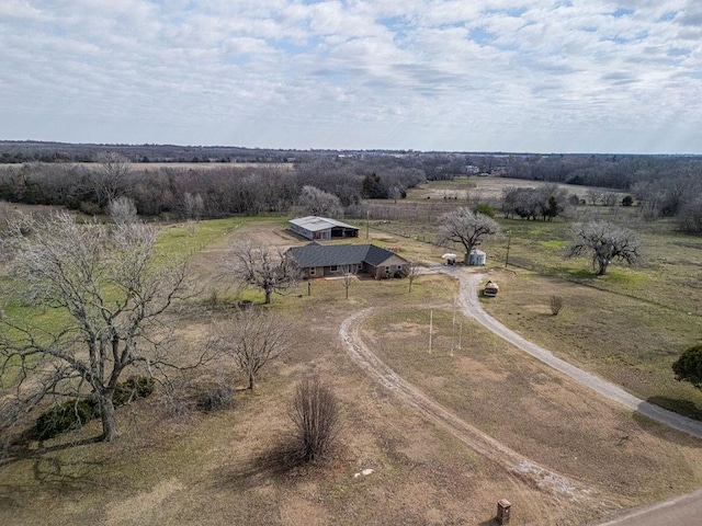 birds eye view of property with a rural view