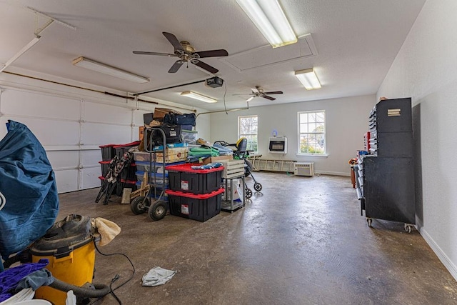 garage with baseboards and a garage door opener