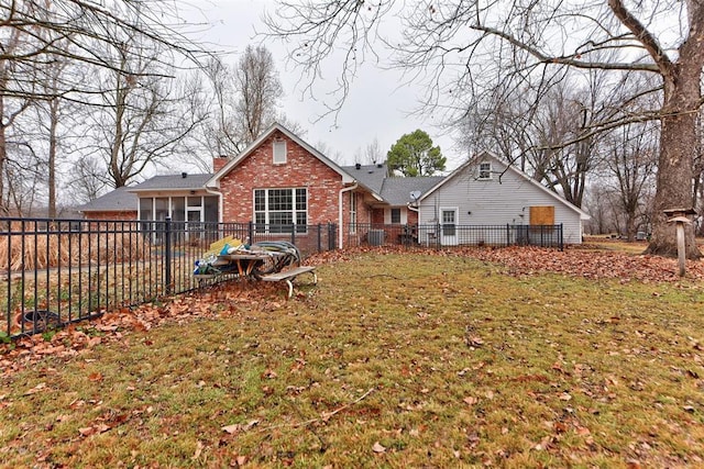 back of property featuring a yard, central AC, and a sunroom