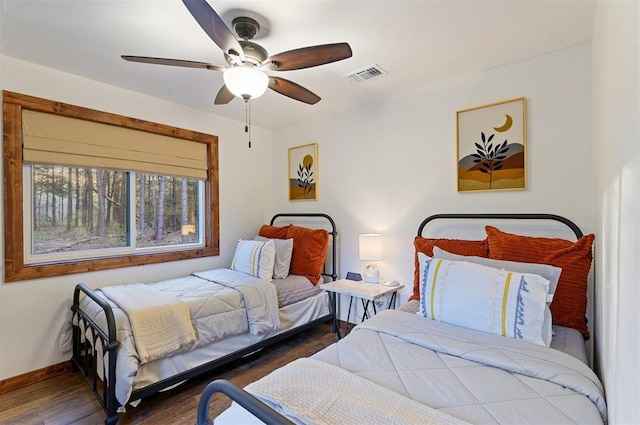 bedroom featuring dark hardwood / wood-style floors and ceiling fan