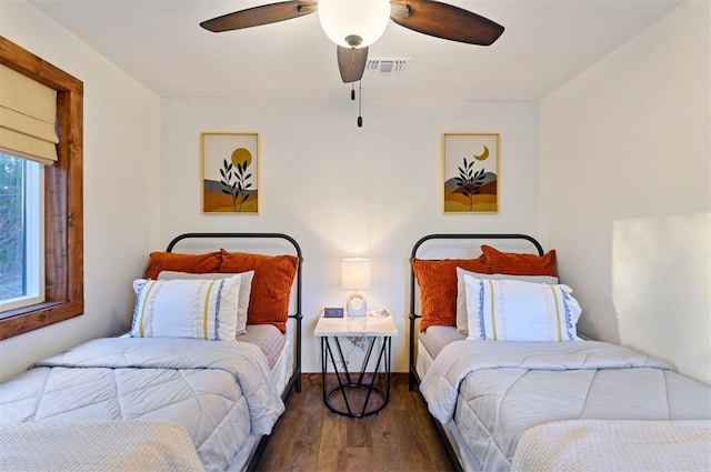 bedroom featuring dark wood-type flooring and ceiling fan