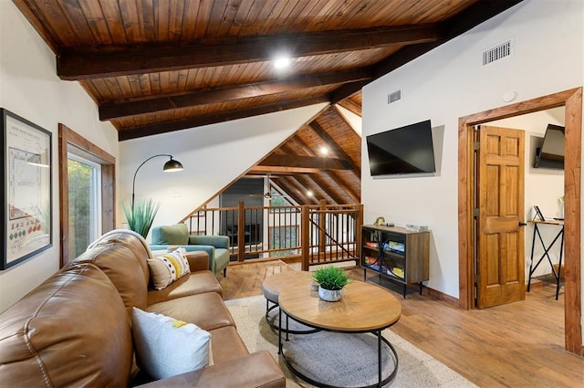 living room featuring wood ceiling, light hardwood / wood-style floors, and vaulted ceiling with beams