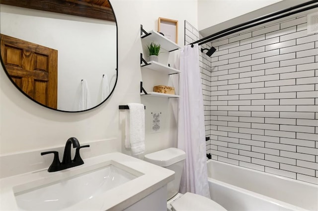 full bathroom with sink, shower / bathtub combination with curtain, and toilet