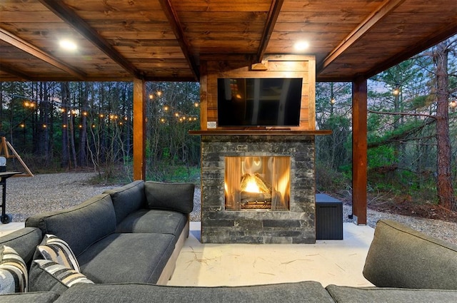 view of patio with an outdoor stone fireplace