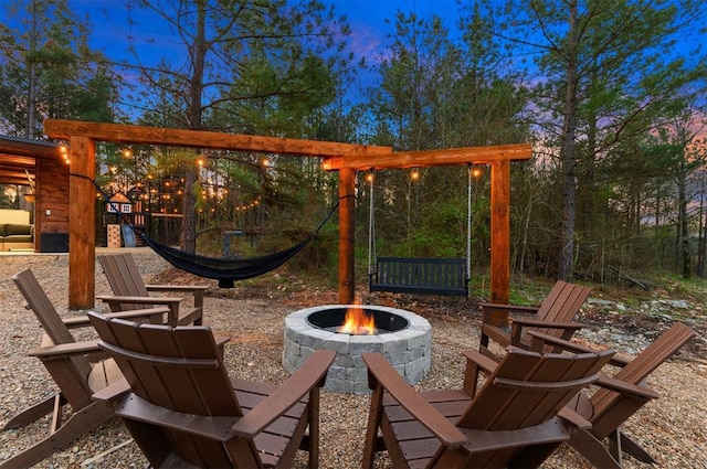 view of patio / terrace with an outdoor fire pit