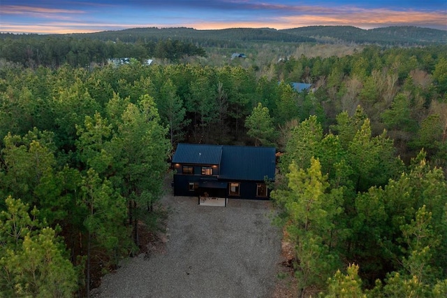 aerial view at dusk featuring a mountain view