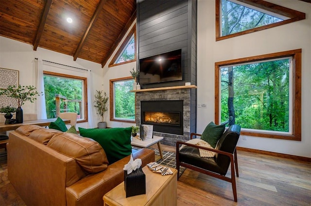 1194 Camp Ranch Rd, Broken Bow, OK 74728 - living area with a large fireplace, wood finished floors, baseboards, high vaulted ceiling, and wood ceiling