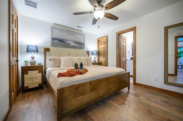 1194 Camp Ranch Rd, Broken Bow, OK 74728 - bedroom featuring hardwood / wood-style flooring, baseboards, ensuite bathroom, and a ceiling fan