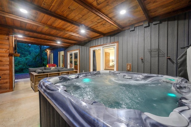 1194 Camp Ranch Rd, Broken Bow, OK 74728 - misc room with a hot tub, beamed ceiling, concrete flooring, and wooden ceiling