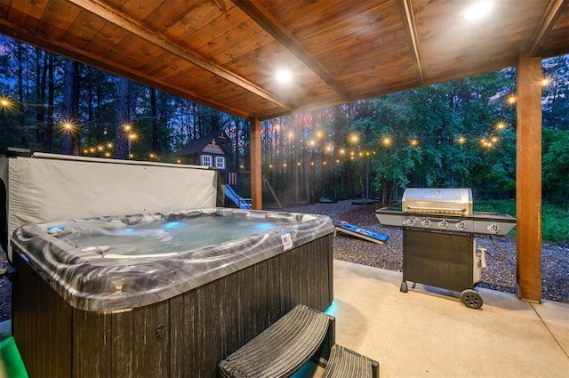 1194 Camp Ranch Rd, Broken Bow, OK 74728 - patio at twilight featuring a hot tub