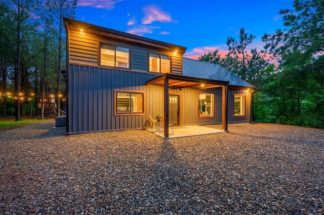 1194 Camp Ranch Rd, Broken Bow, OK 74728 - back of property featuring board and batten siding and metal roof