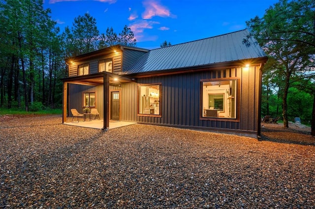 1194 Camp Ranch Rd, Broken Bow, OK 74728 - back of property featuring a patio area and metal roof